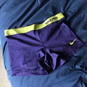 Navy and lime green Nike compression shorts